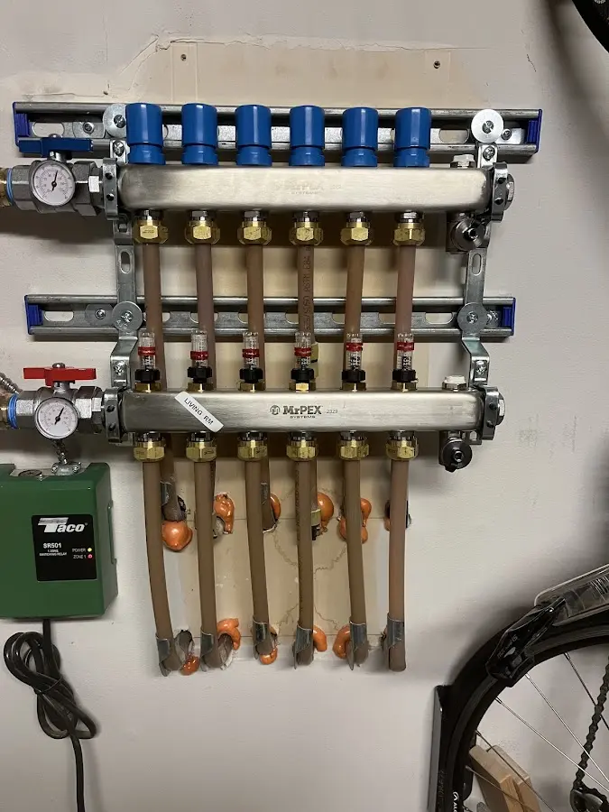 Plumber performing Water Heater Repair at a residential property in Woodland Park